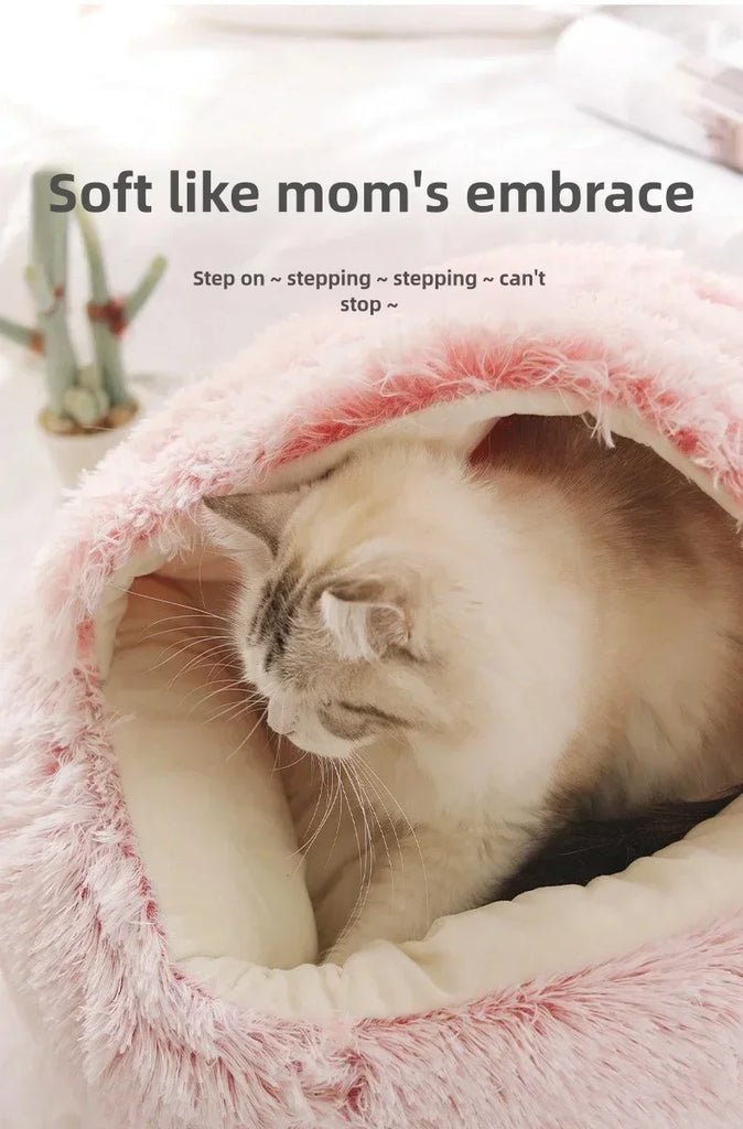 Cat snuggled in a pink plush blanket with text 'Soft like mom's embrace'.