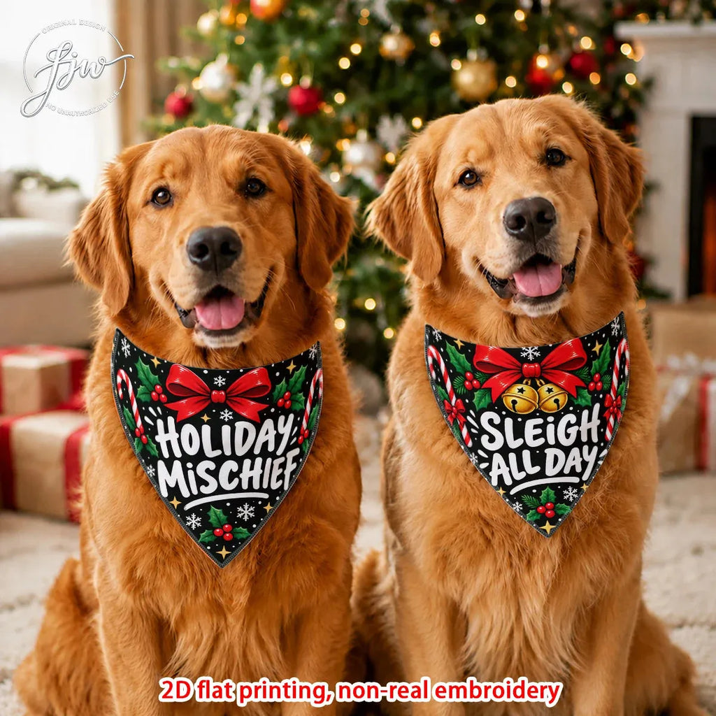 Two golden retriever dogs sitting side by side in a festive holiday setting, wearing black bandanas with red bows, green holly, candy canes, and white text that reads 'HOLIDAY MISCHIEF' and 'SLEIGH ALL DAY'. A blurred Christmas tree and wrapped gifts are in the background.