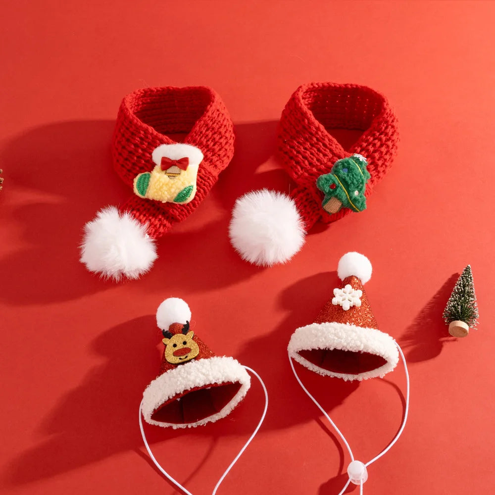 Red knitted baby booties with white pom-poms on a red background