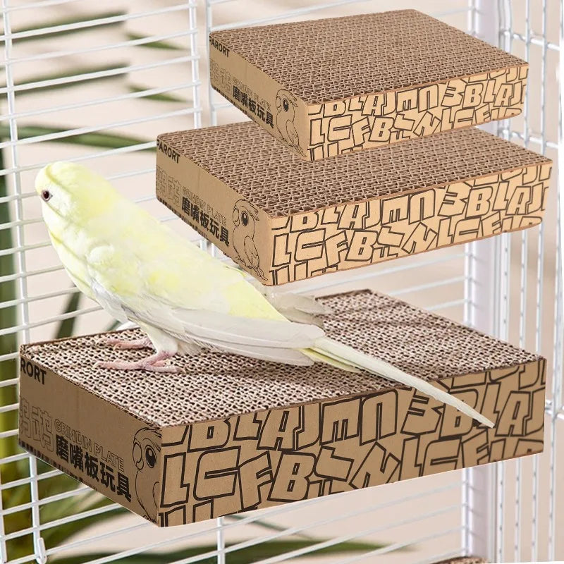 Cardboard bird perches with a parakeet on top, set against a white background.