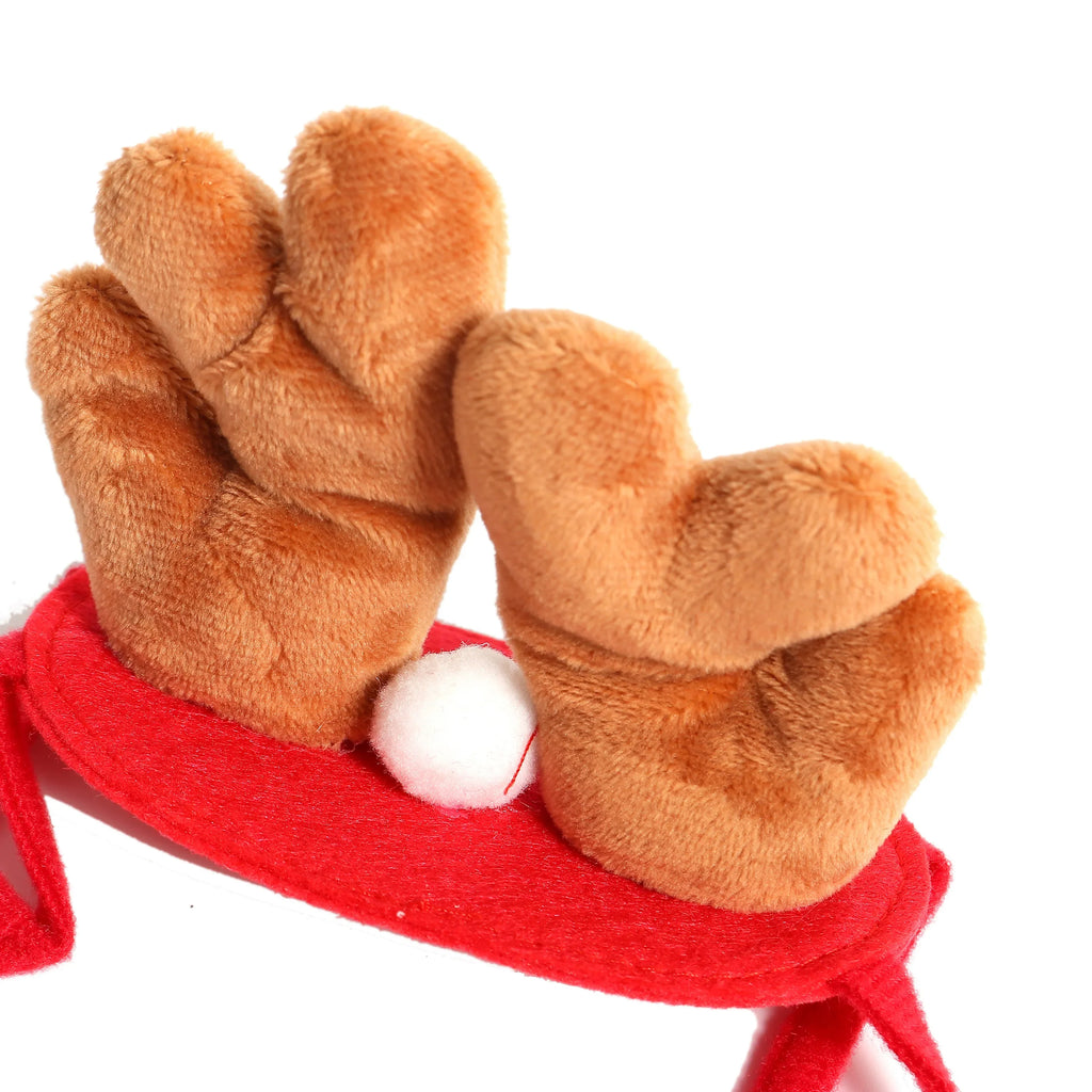 A plush reindeer antler headband featuring two brown faux-fur antlers attached to a red felt band with a small white pom-pom accent, shown on a plain white background.