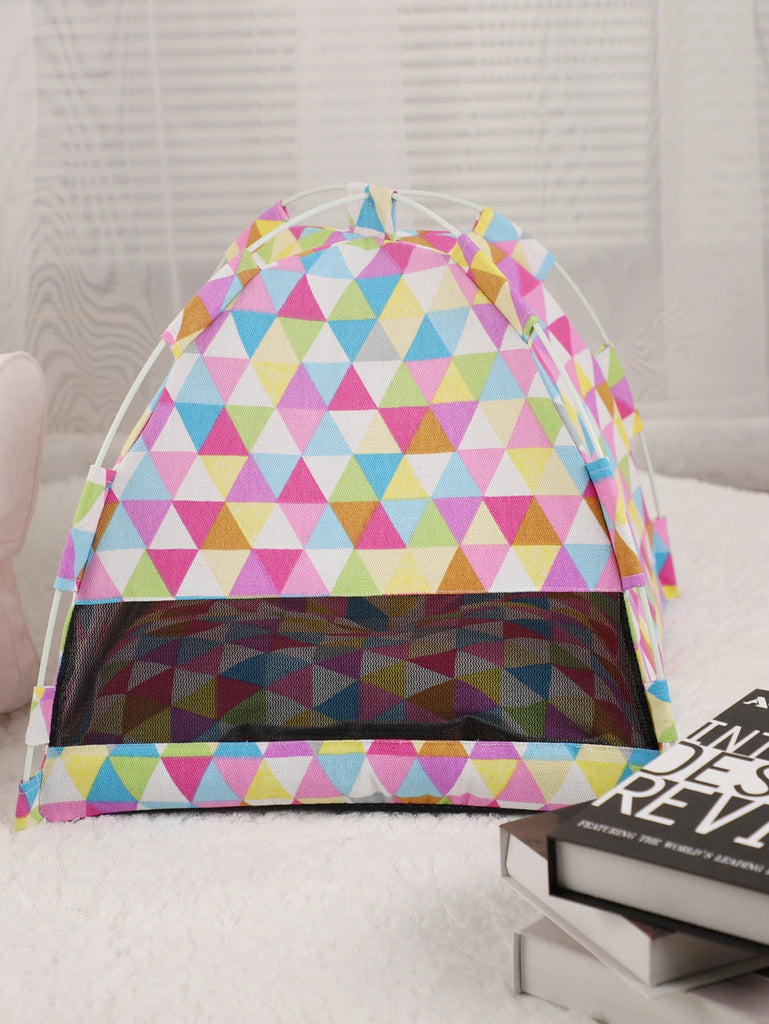 Colorful geometric-patterned tent on a light gray background
