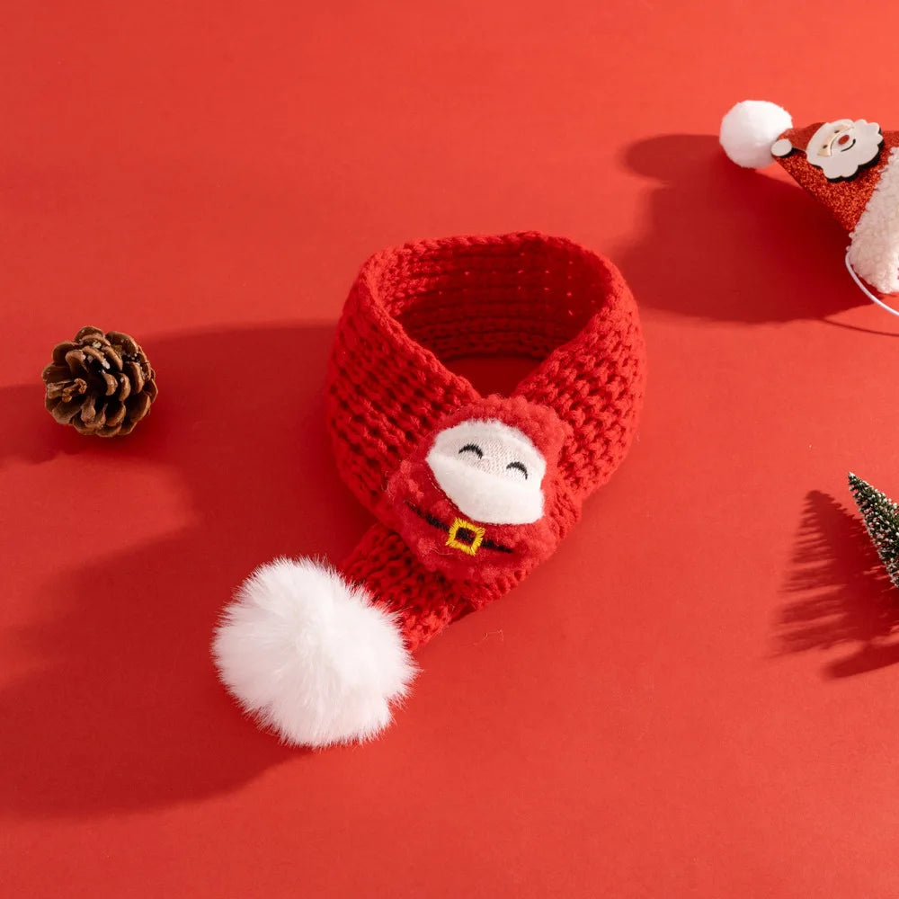 Red knitted scarf with a face design on a red background