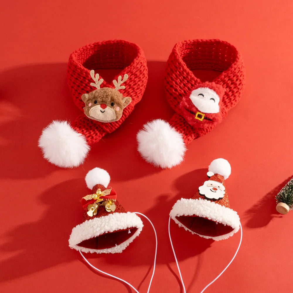 A set of red and white Christmas-themed baby accessories, including a pair of knit booties with a reindeer and Santa face, and two matching fuzzy headbands with Santa and reindeer designs, arranged on a solid red background.