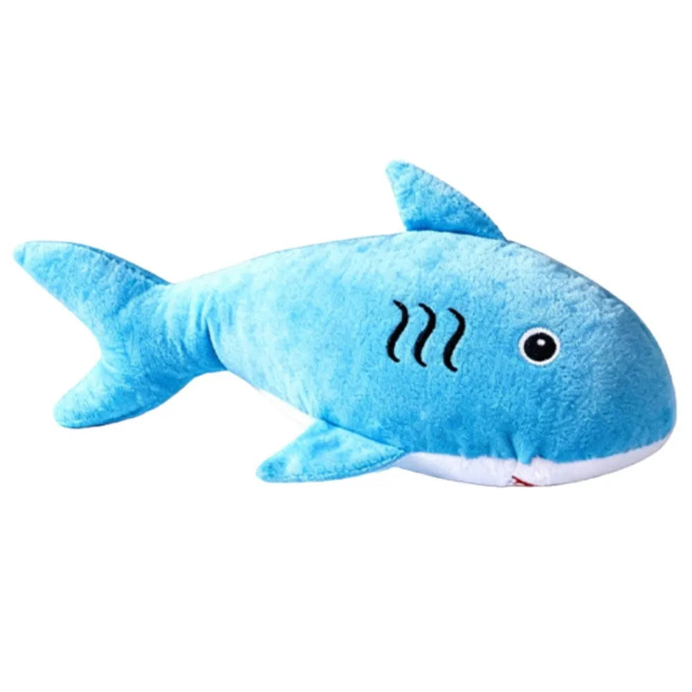 Blue shark-shaped plush toy on a white background
