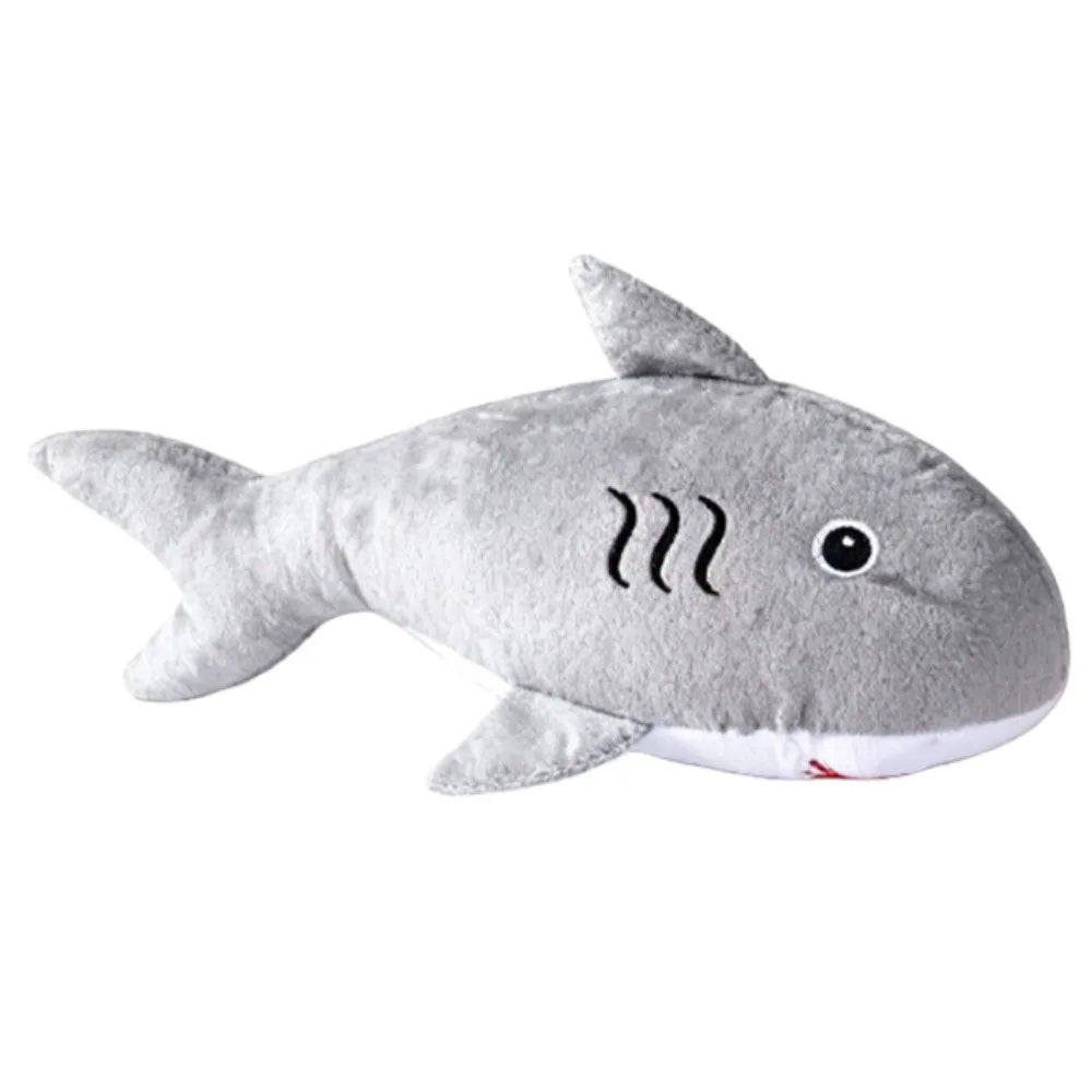 Gray shark plush toy on a white background