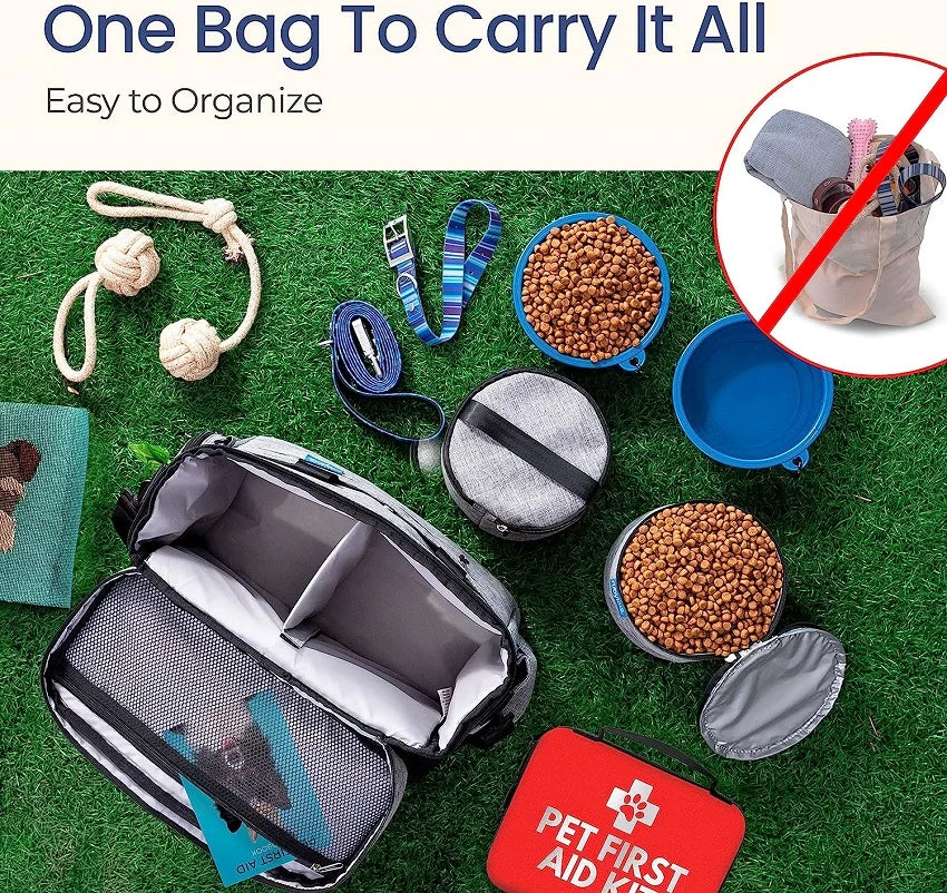 Pet travel bag with pet accessories on a grass background