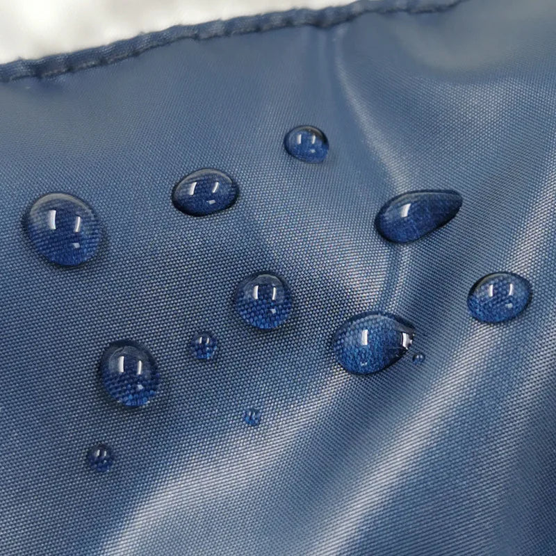 Water droplets on a blue fabric surface