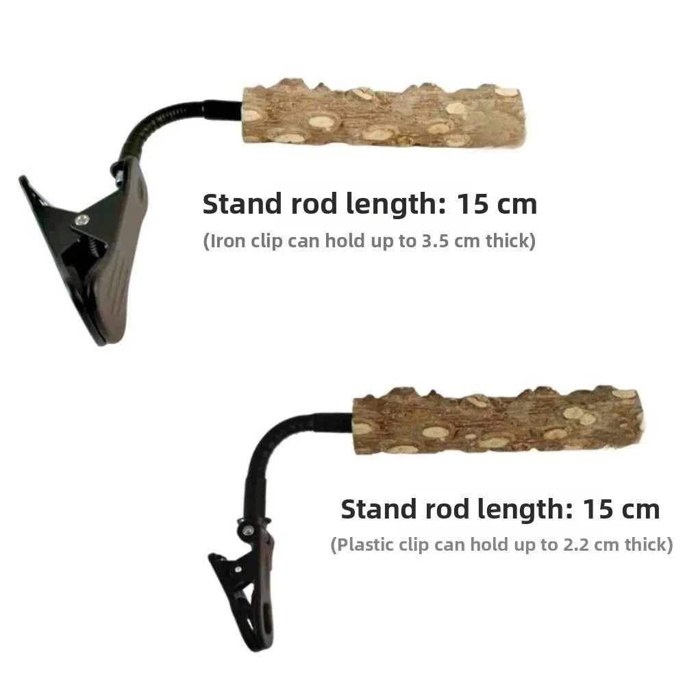 Two views of a pet lick mat stand on a white background, one with a black iron clip and one with a black plastic clip, both with a natural wood bark rod. Text overlays specify the stand rod length as 15 cm and the clip holding capacities.