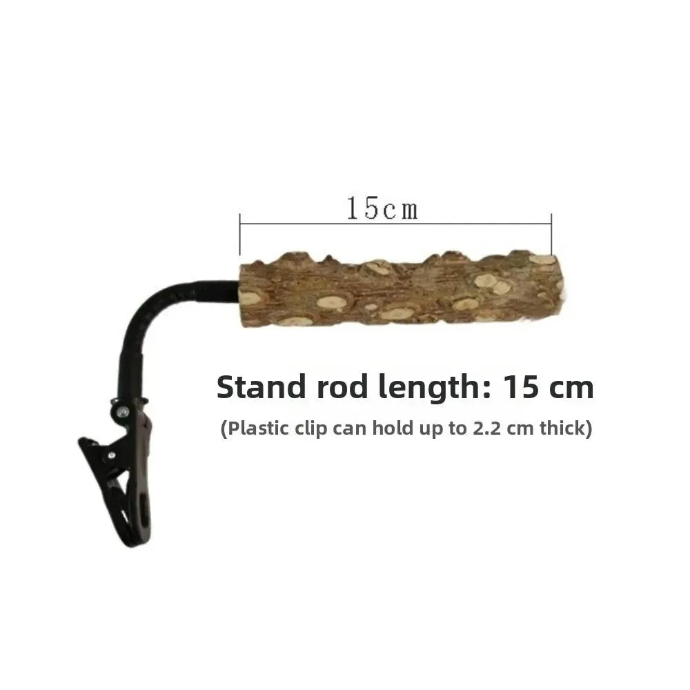 A black plastic clip stand holding a textured brown wood rod, shown on a white background with text indicating a 15 cm stand rod length and clip holding capacity.