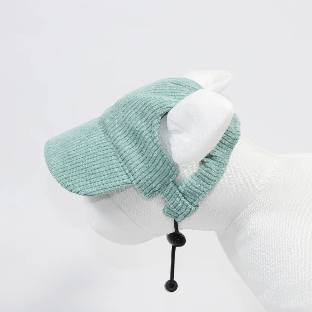 Light blue knitted cap with a black cord on a mannequin head against a white background