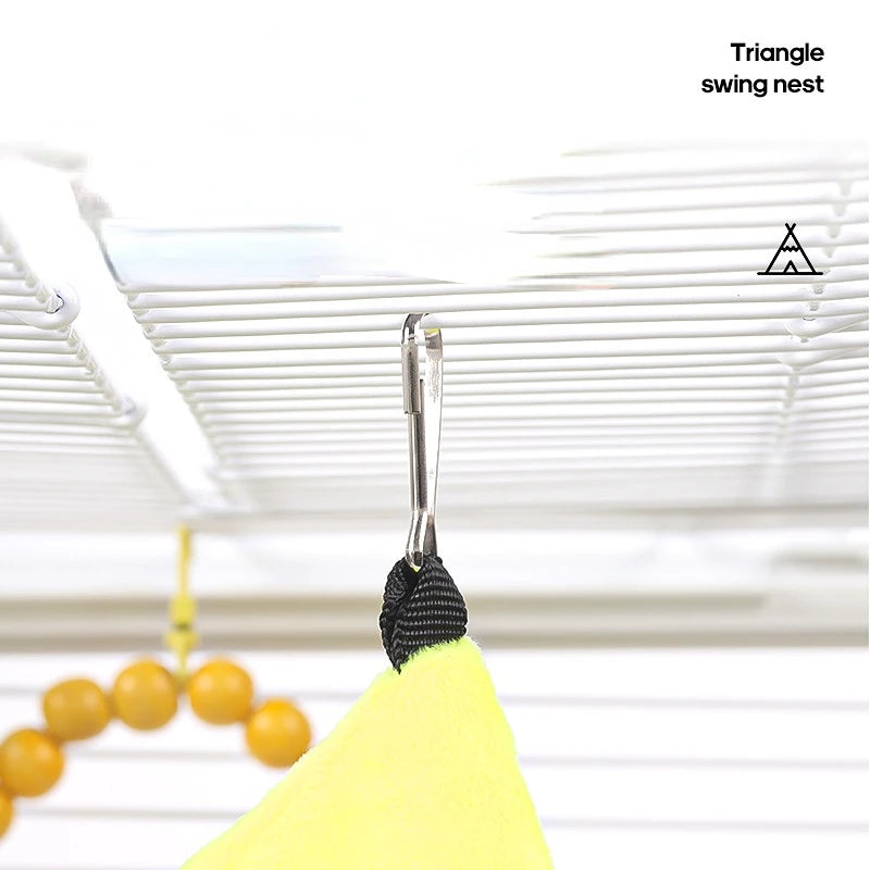 Yellow swing nest with a metal hook against a white background