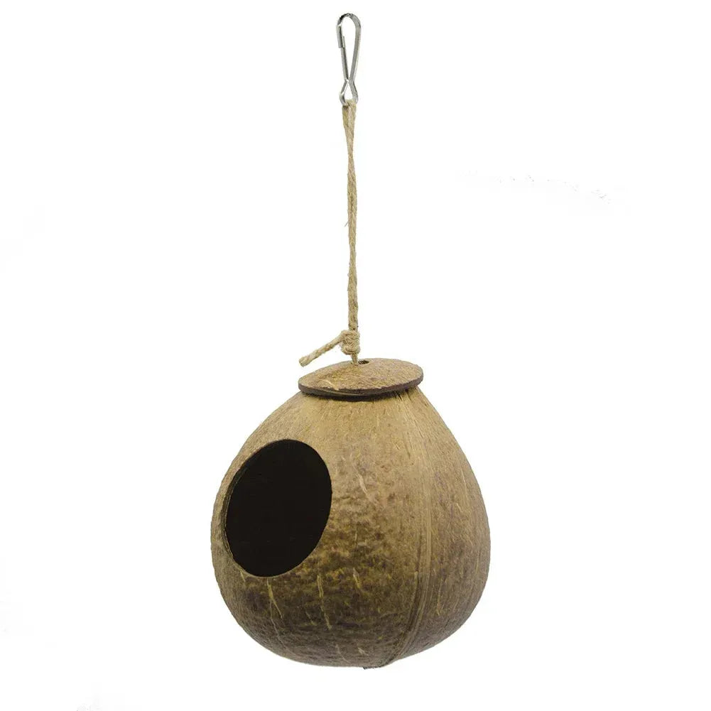 Coconut shell birdhouse with a rope hanging on a white background