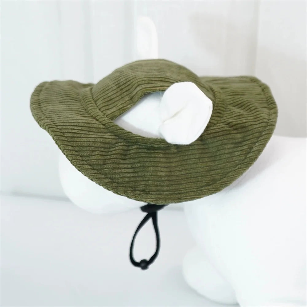 An olive green corduroy pet collar with a white fabric insert and a black drawstring, displayed on a white mannequin head.