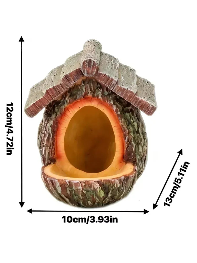 A hollowed-out acorn birdhouse ornament with a textured bark exterior, a gray stone-look roof, and a warm orange interior, shown with dimension arrows and labels indicating 12cm height, 13cm diagonal depth, and 10cm width on a white background.