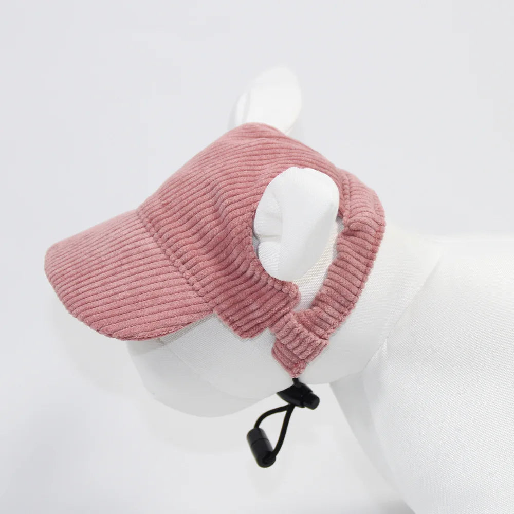 Pink knitted headband with ear covers on a mannequin head against a white background