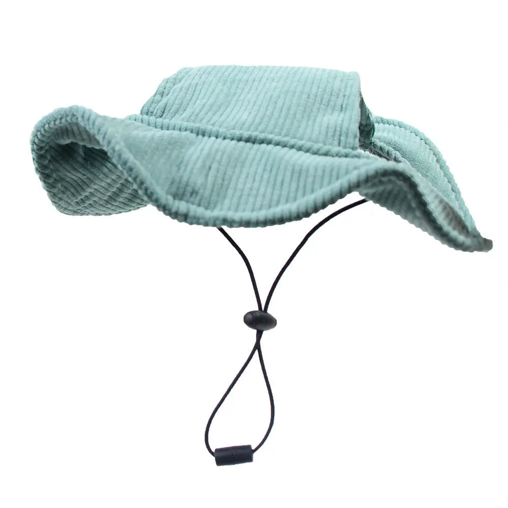 Light blue corduroy hat with a chin strap on a white background