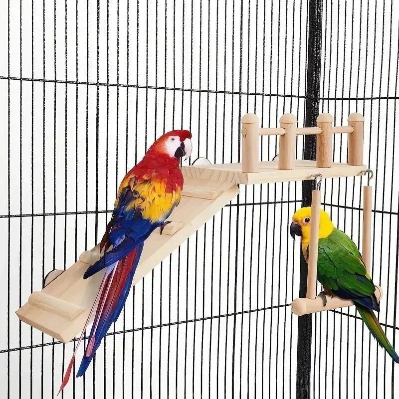 Two parrots on a wooden bird perch inside a cage.