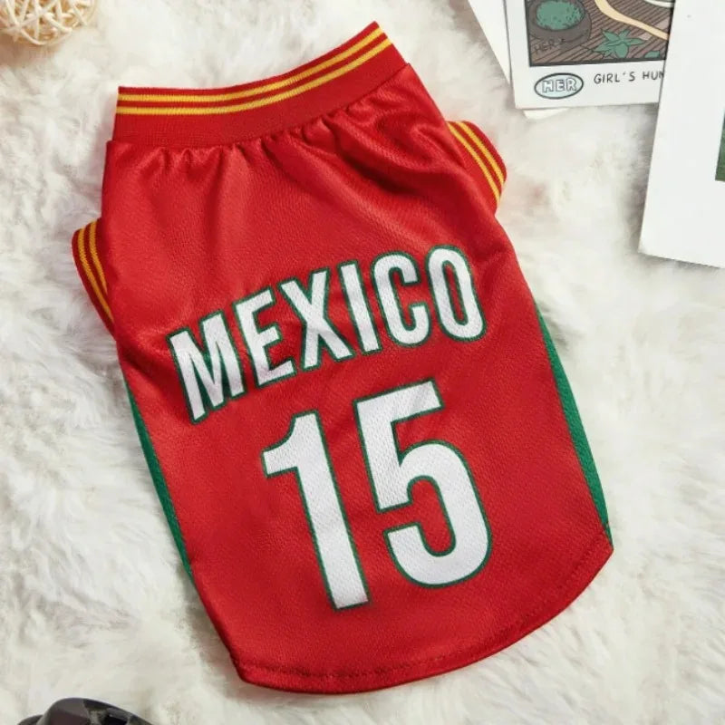 Red pet jersey with 'MEXICO 15' printed on it, placed on a white surface.