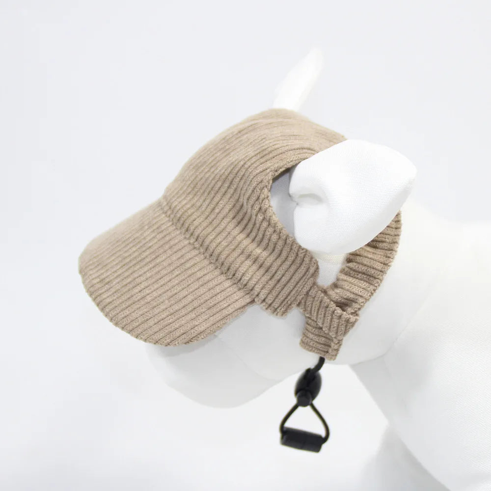 Beige knitted visor on a mannequin head against a white background