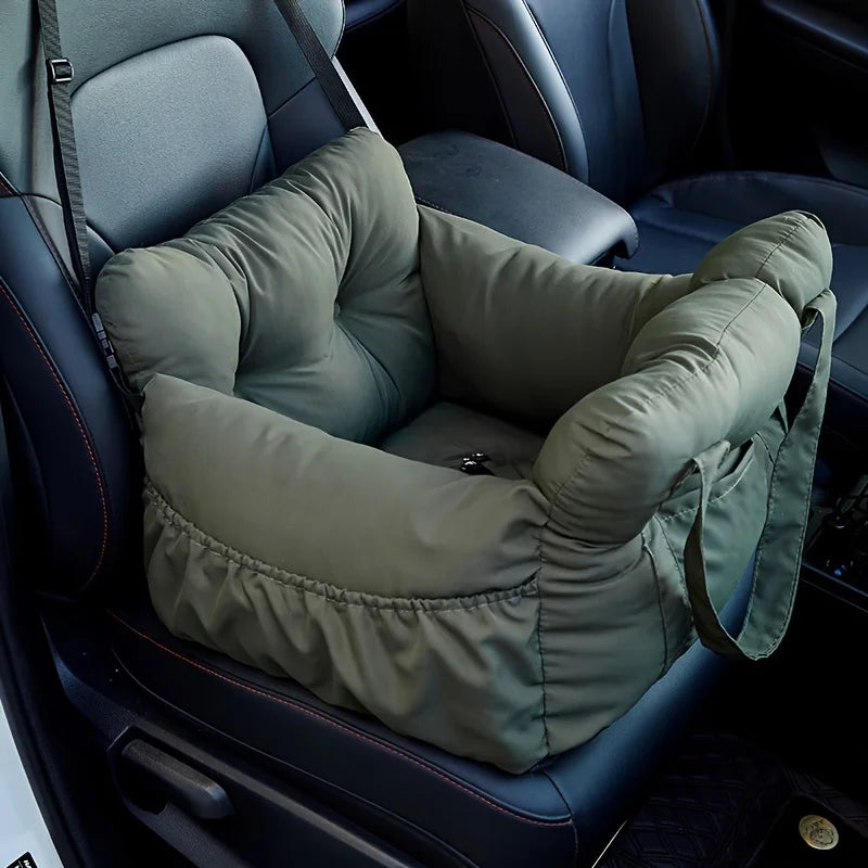 Green pet seat cover in a car seat