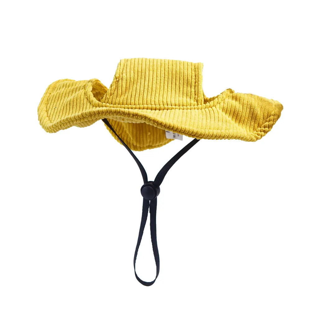 Yellow bucket hat with a black strap on a white background