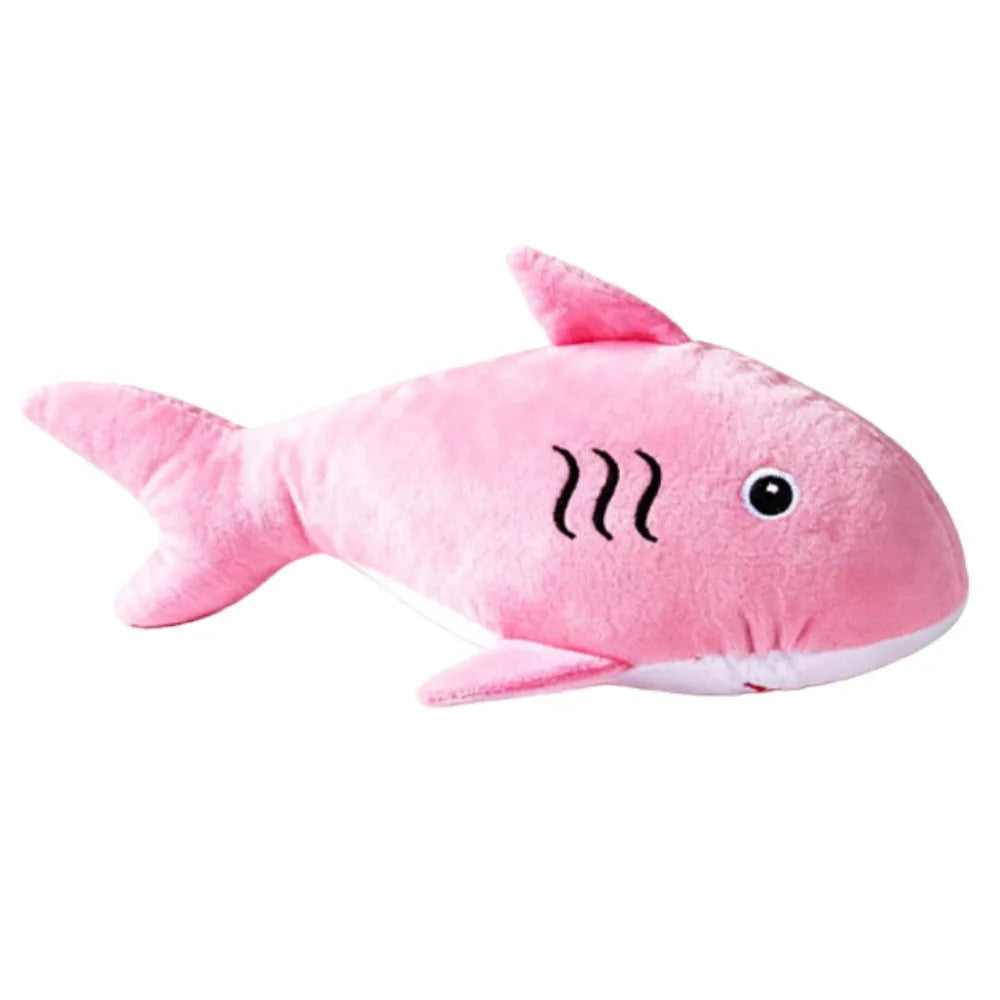 Pink shark-shaped plush toy on a white background