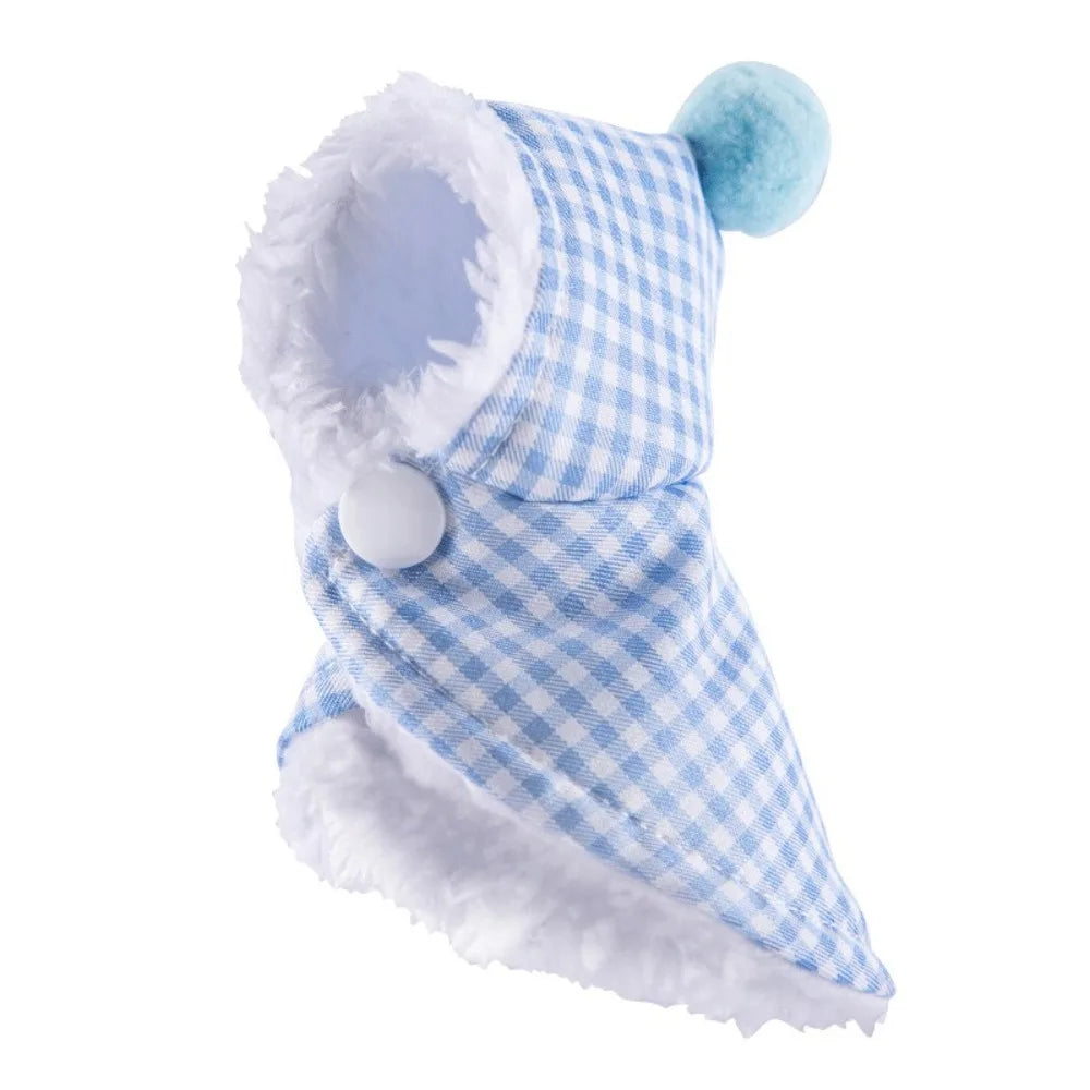 A small blue and white gingham pet hood with white faux fur trim and a light blue pom-pom on a white background.