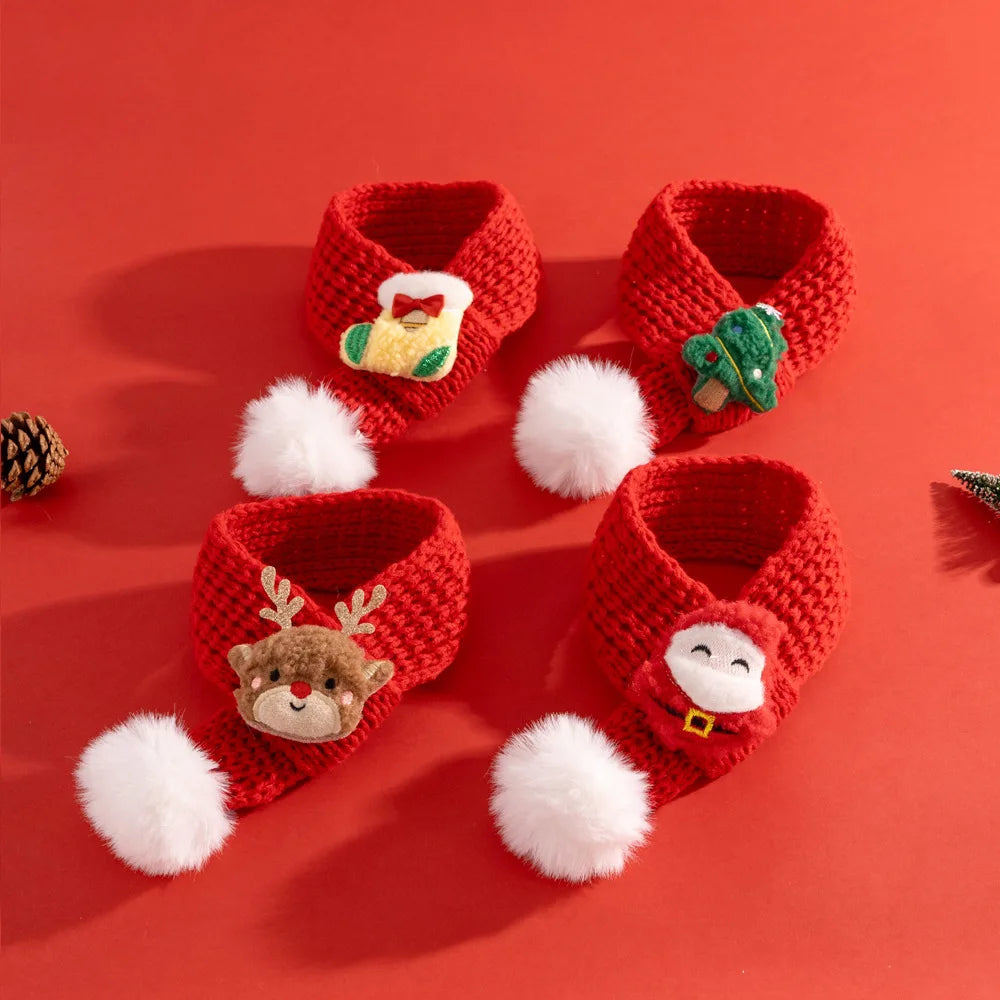 Set of red crochet baby booties with festive designs on a red background