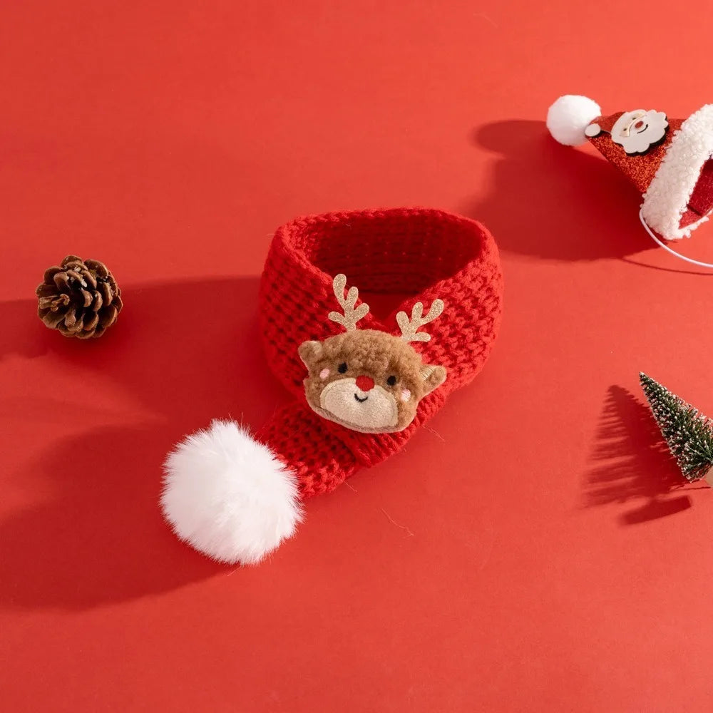 Red knitted reindeer hat with white pom-pom on a red background