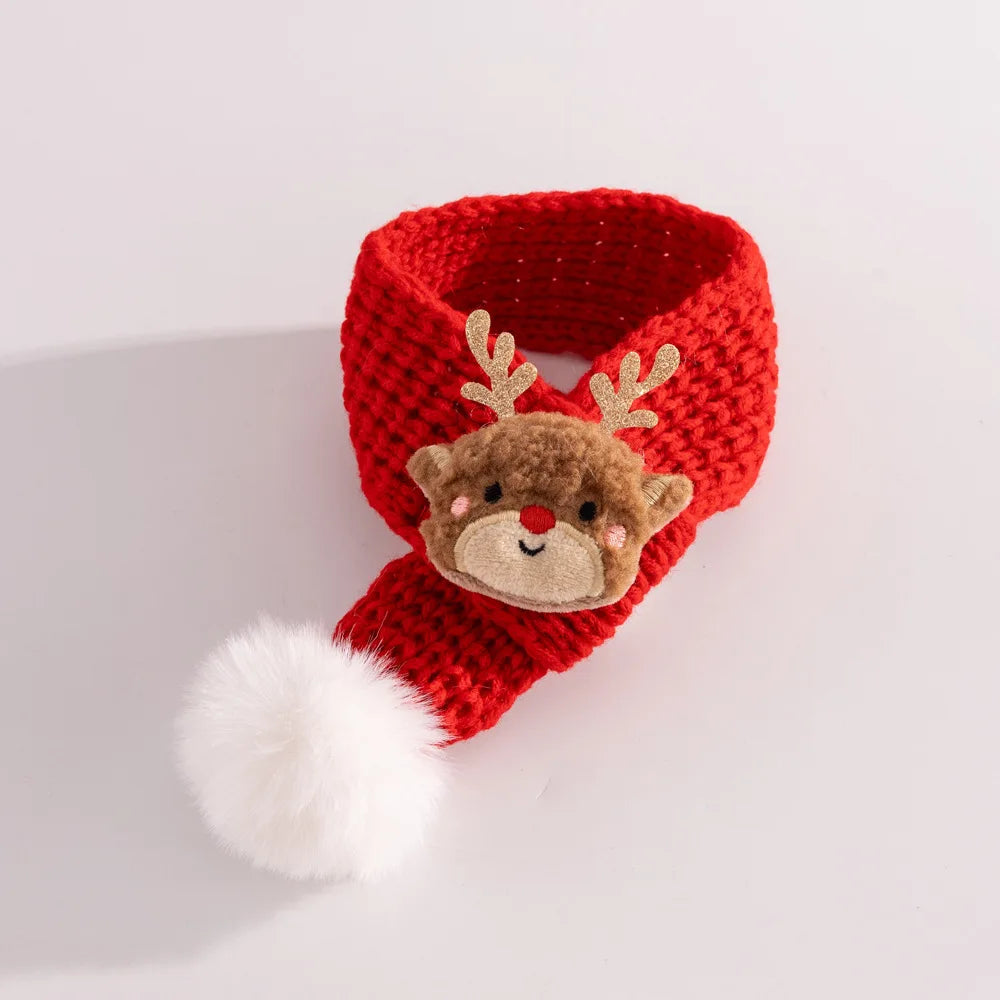 A red knitted Christmas-themed accessory with a plush reindeer face and a white pom-pom, photographed on a clean white background.