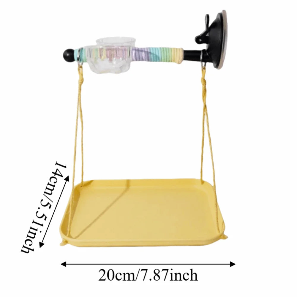 Yellow swing with a colorful handle and suction cup on a white background