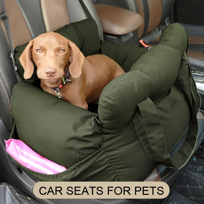 Dog sitting in a green pet car seat inside a vehicle.