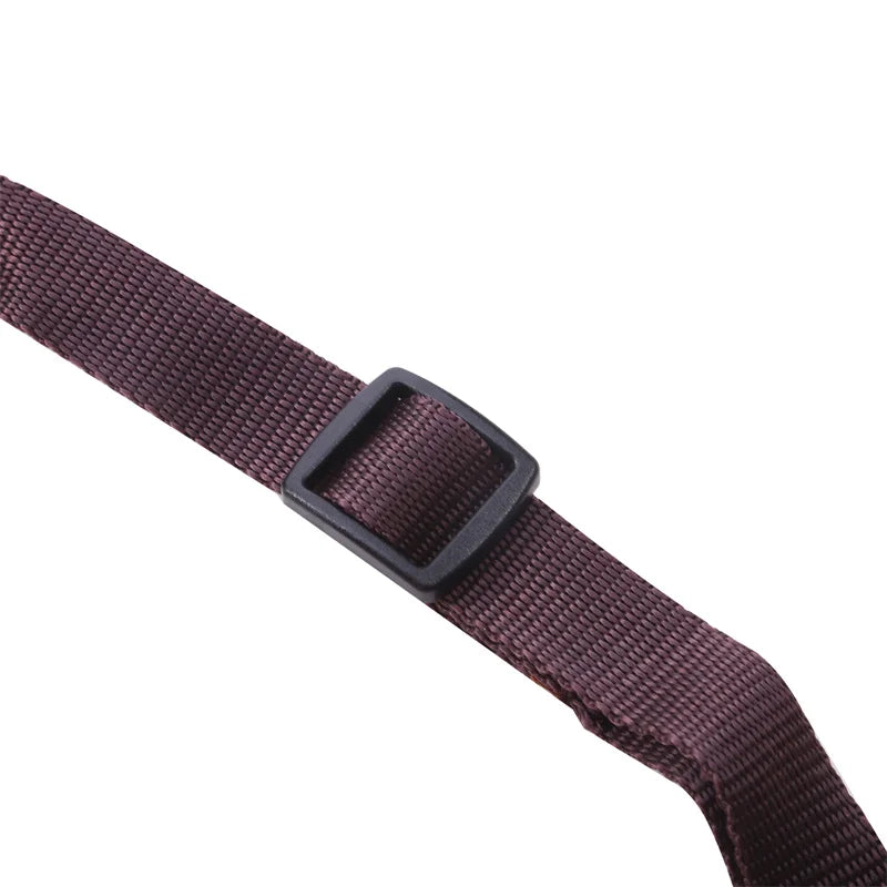 Maroon belt with a black buckle on a white background