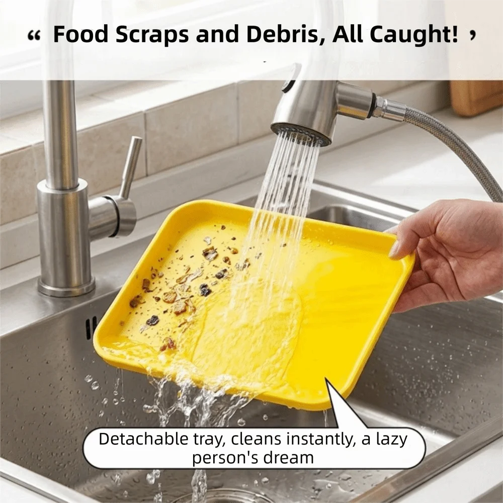 Yellow detachable tray being rinsed under a faucet in a kitchen sink.