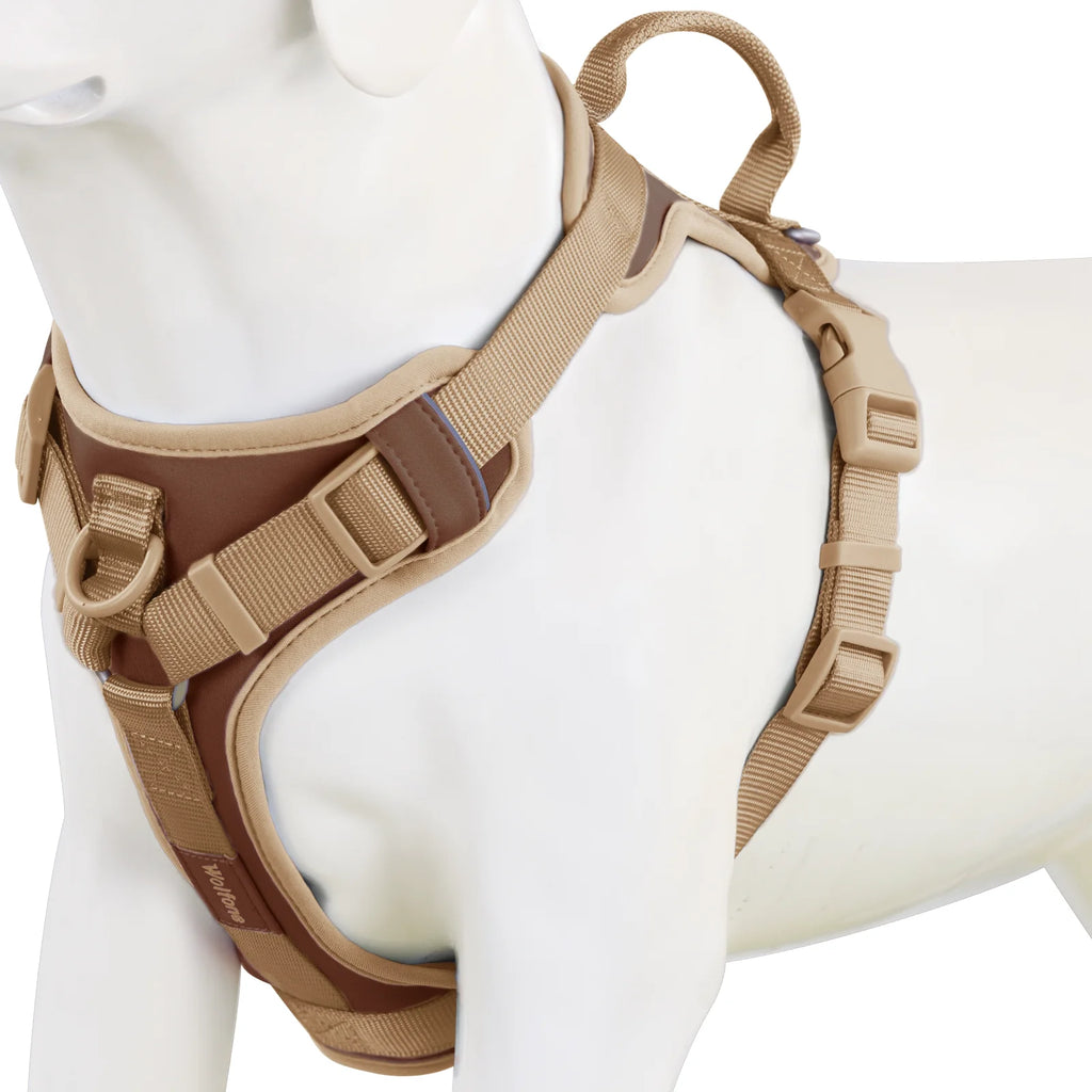 Tan dog harness on a mannequin with a white background