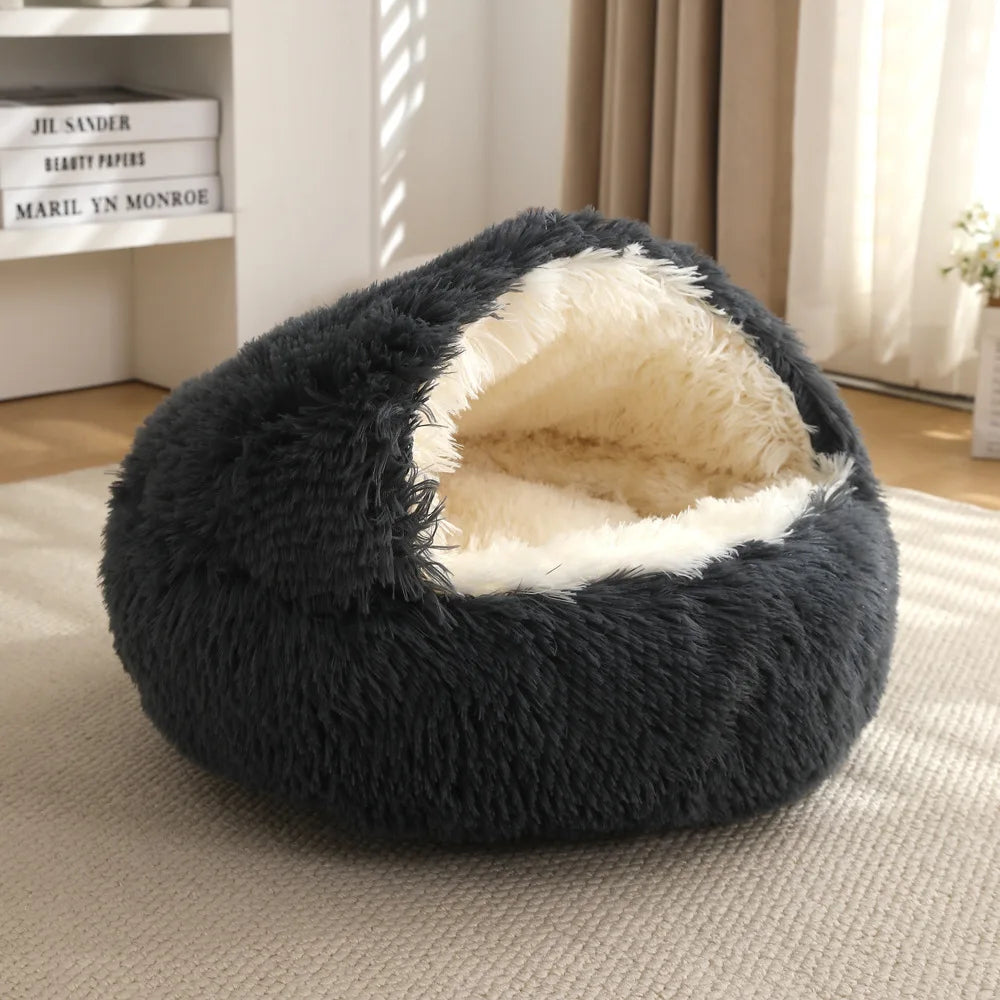 Fluffy dark gray pet bed with white interior on a beige carpet