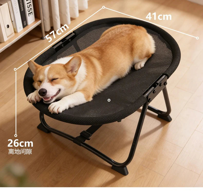 Dog lying on a black pet bed with measurements indicated