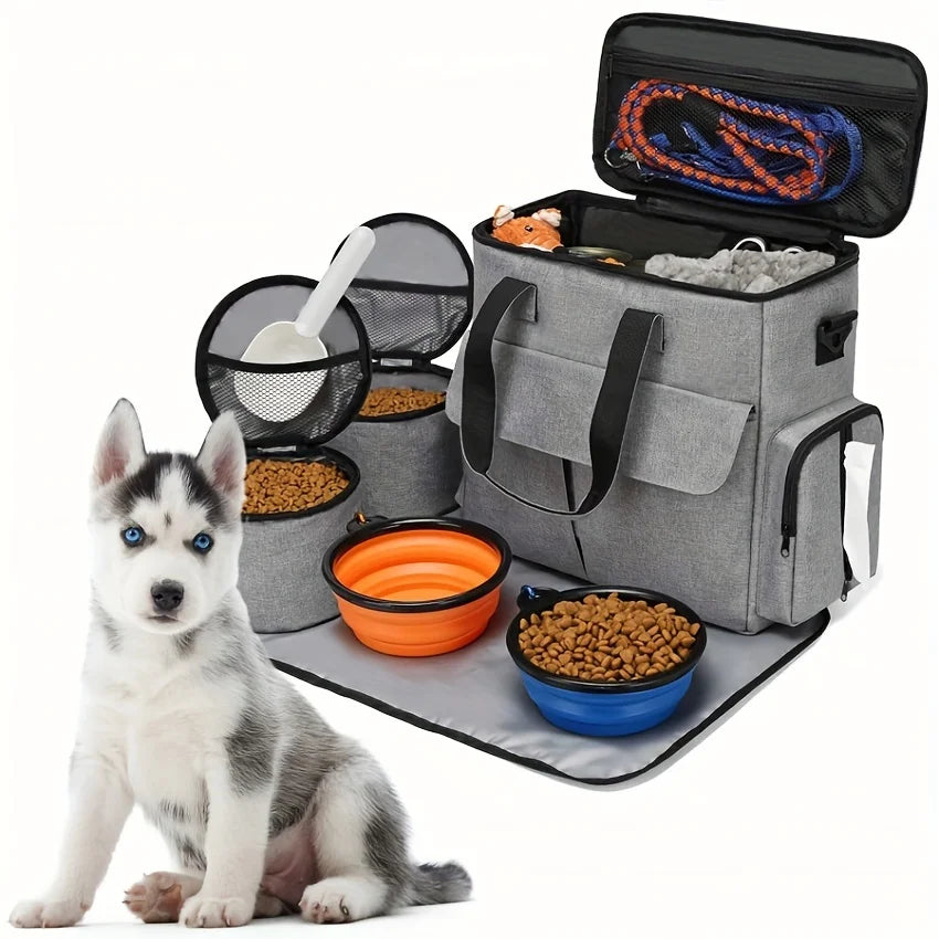 Pet travel bag with food bowls and a dog on a white background