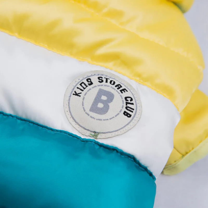 Close-up of a yellow and blue fabric with a 'Kings Store Club' label.