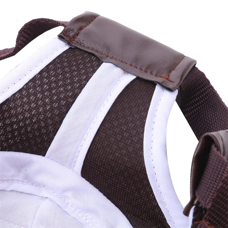 Close-up of a brown and white dog harness on a white background