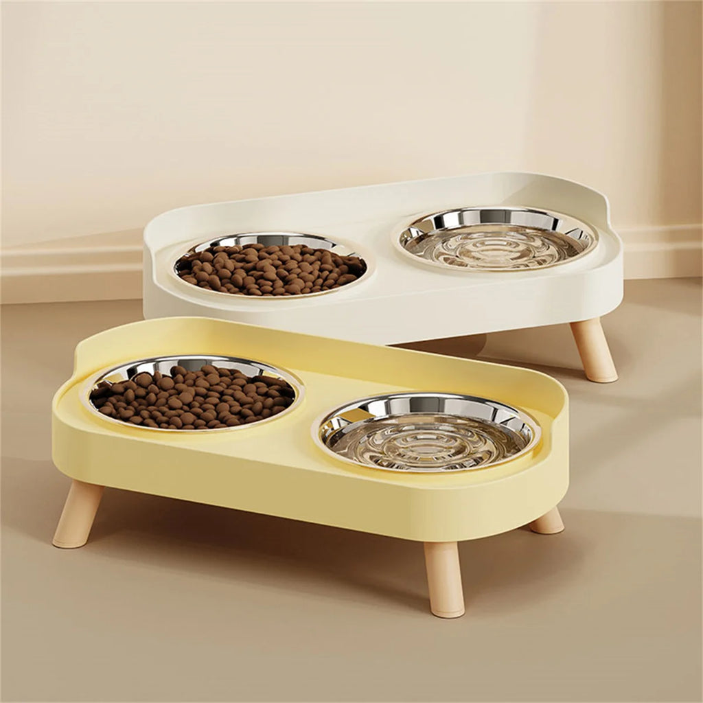 Two-tiered pet feeder with bowls containing food on a beige surface.