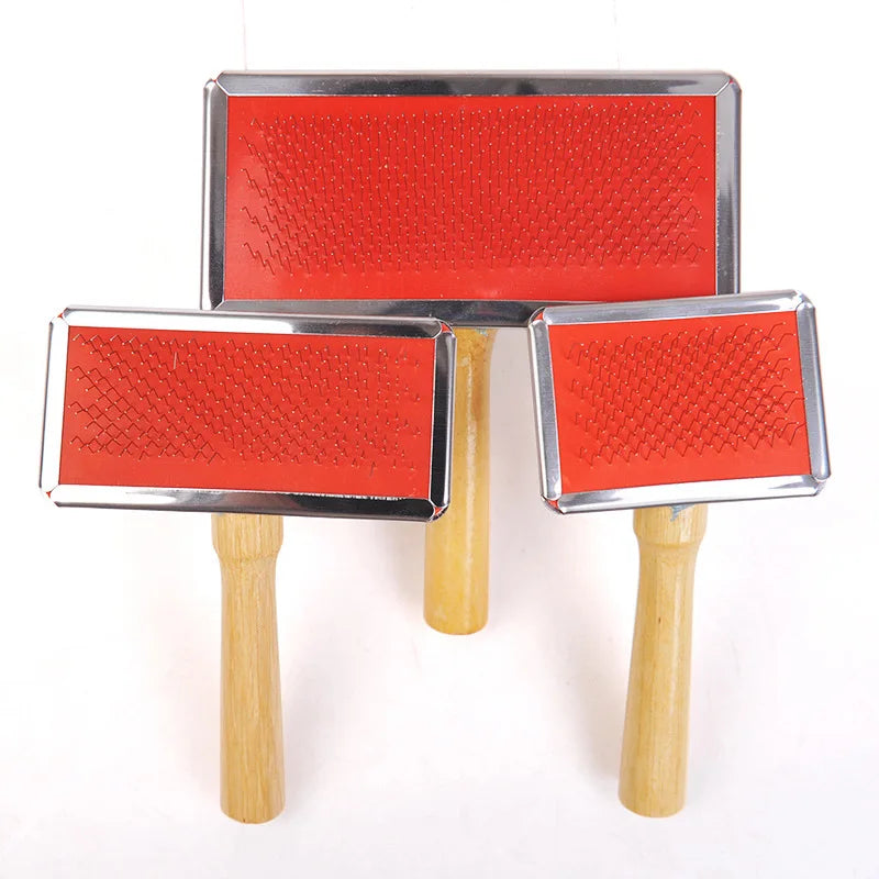 Three red pet grooming brushes with wooden handles on a white background