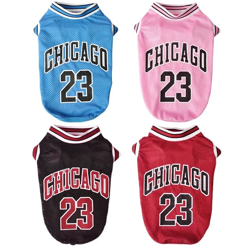 Four dog jerseys with 'Chicago' and number '23' in blue, pink, black, and red on a white background.