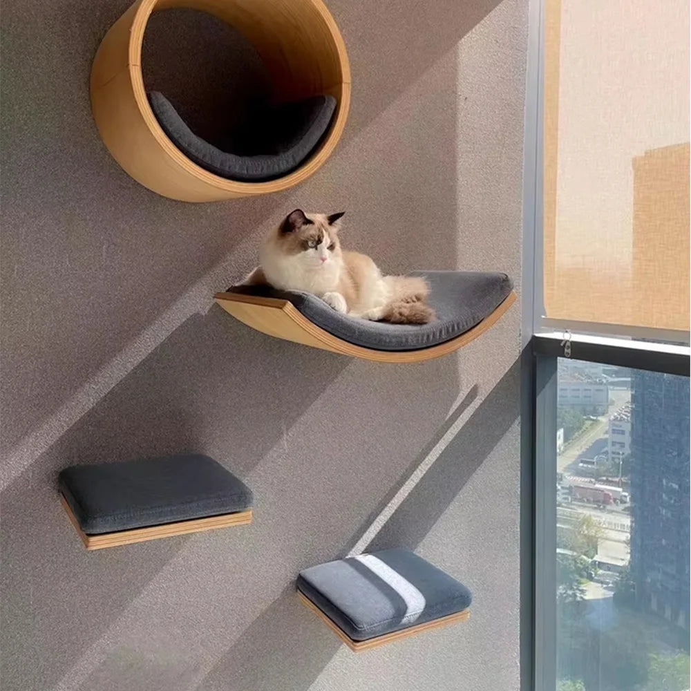 Cat lounging on a modern wall-mounted pet bed with a cityscape view.