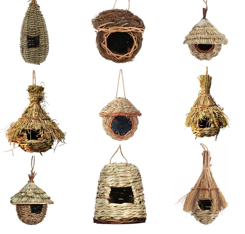 Set of handmade straw birdhouses on a white background