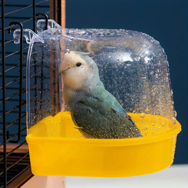 Parrot inside a yellow bath tub with a transparent lid on a dark background