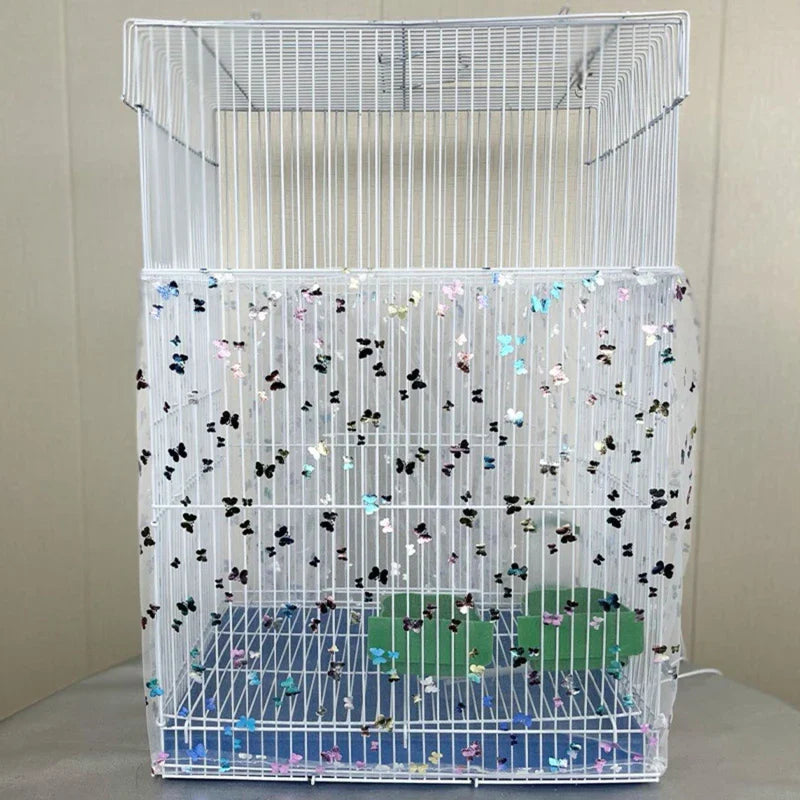 Bird cage with decorative mesh and colorful butterflies on a plain background