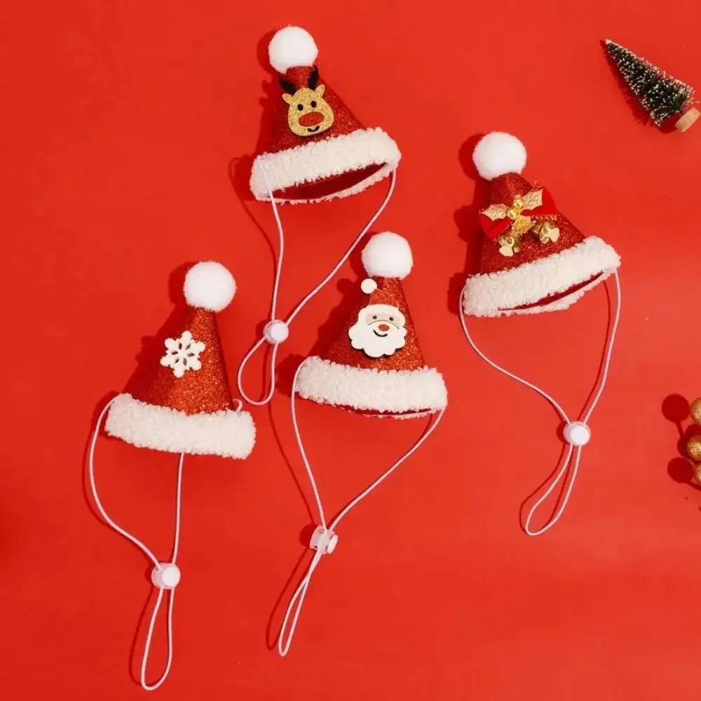 Four festive Santa hat face masks with white ear loops, arranged on a bright red background. The hats are red with white faux fur trim, white pom-poms, and holiday decorations including a reindeer, snowflake, Santa face, and gold snowflake.