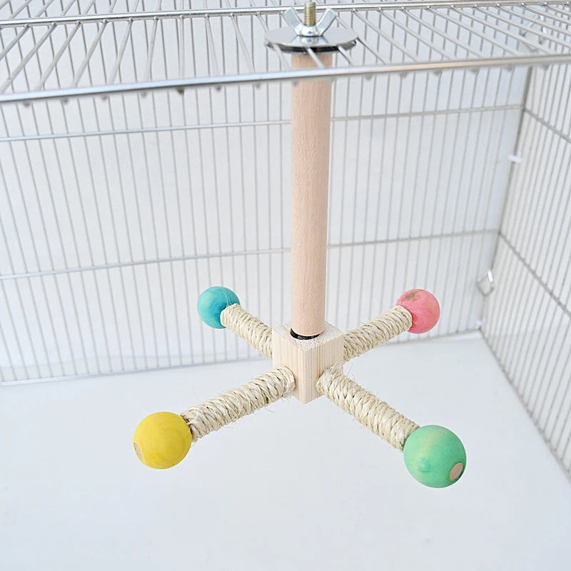 Bird cage perch with colorful wooden balls inside a birdcage